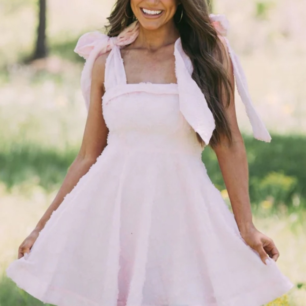 Pink tie dress from These Three Boutique.